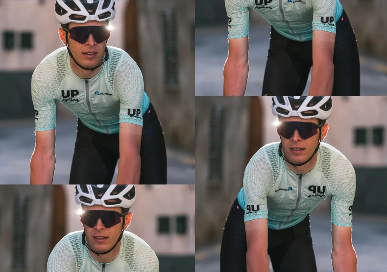 En syklist i en lysblå mønstret trøye med logoen 'UP cycling' og merkenavnet 'owayo' på brystet, som sykler på en sykkel.